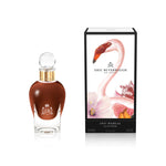 100 ml bottle, with transparent glass and amber perfum. Spherical cap with gold band. By his side the box, with pink flamingo and flowers illustration, within a black border. 1947 Dalhia, a fragrance by Eric Butherbaugh.