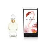 100 ml bottle, with transparent glass and yellowish perfum. Spherical cap with gold band. By his side the box, with pink flamingo and flowers illustration, within a black border. Fabulous Magnolia, a fragrance by Eric Butherbaugh.
