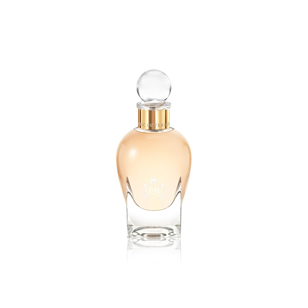 100 ml bottle, with transparent glass and orangey perfum. Spherical cap with gold band. Melrose Fresia, a fragrance by Eric Butherbaugh.