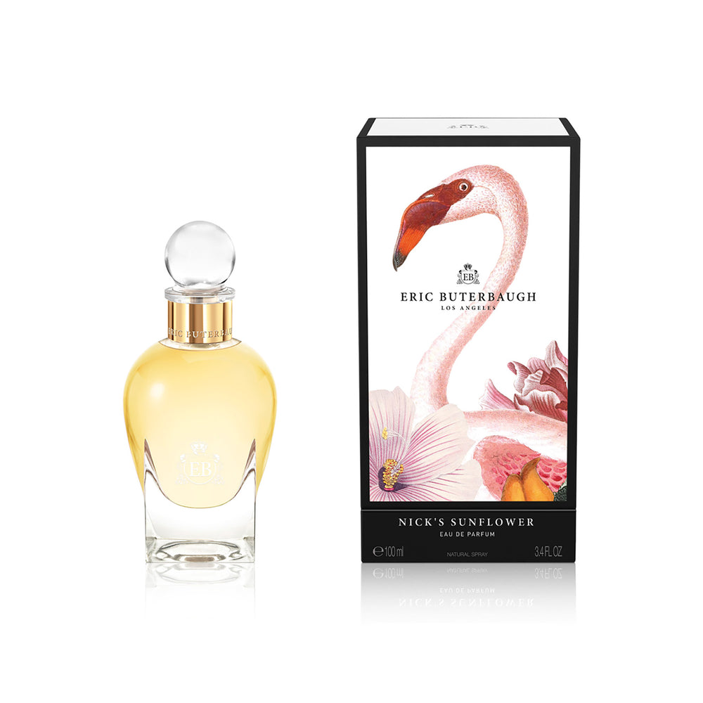 100 ml bottle, with transparent glass and yellowish perfum. Spherical cap with gold band. By his side the box, with pink flamingo and flowers illustration, within a black border. Nick´s Sunflower, a fragrance by Eric Butherbaugh.