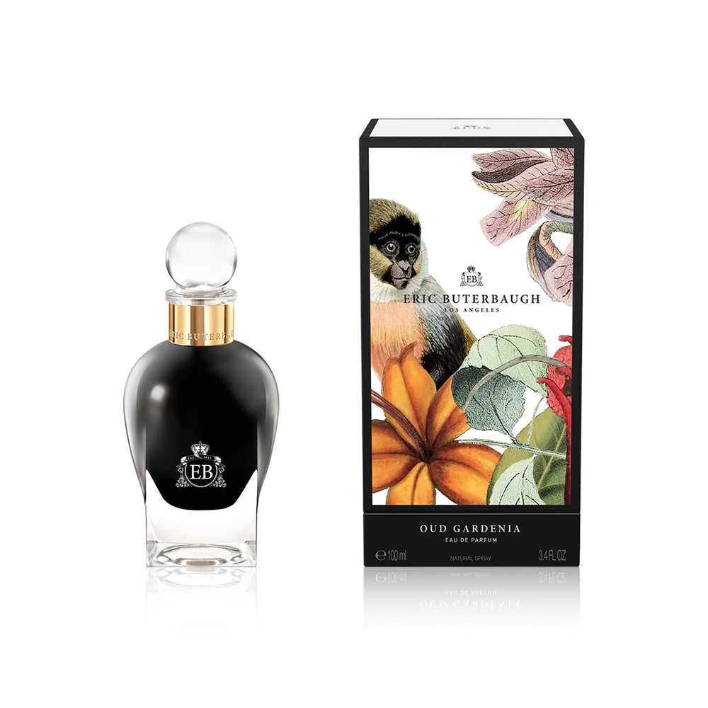 100 ml bottle, with  black opaque glass. Spherical cap with gold band. By his side the box, with monkey and plants illustration, within a black border. Oud Gardenia, a fragrance by Eric Butherbaugh.