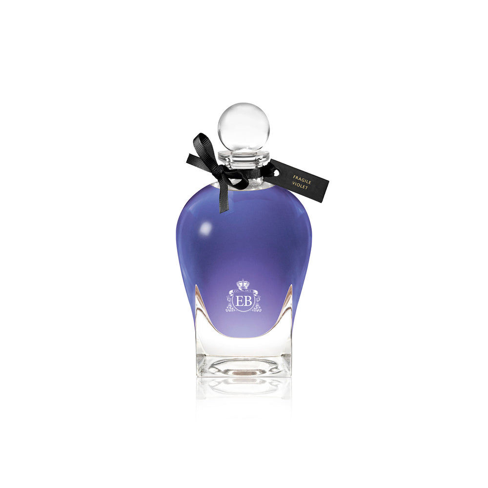 250 ml bottle, with transparent glass and violet perfum. Spherical cap with black ribbon. Fragile Violet, a fragrance by Eric Butherbaugh.