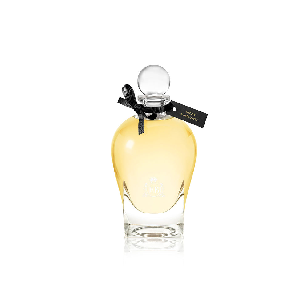 250 ml bottle, with transparent glass and yellowish perfum. Spherical cap with black ribbon. Nick´s Sunflower, a fragrance by Eric Butherbaugh.