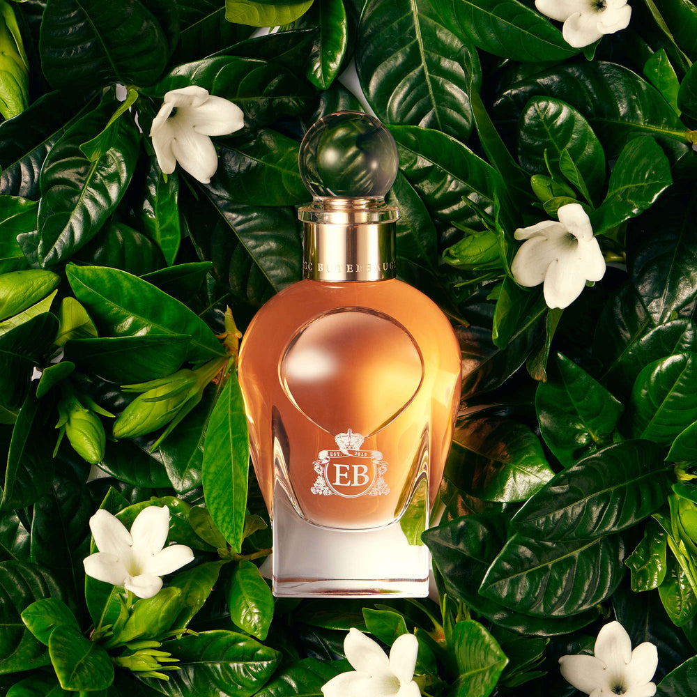 A 100 ml Maiden Orange Blossom bottle lying on a bed of orange blossoms.